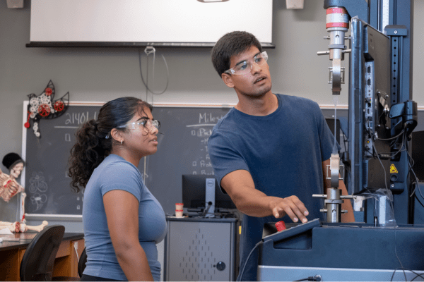 Two bioengineering students using equipment