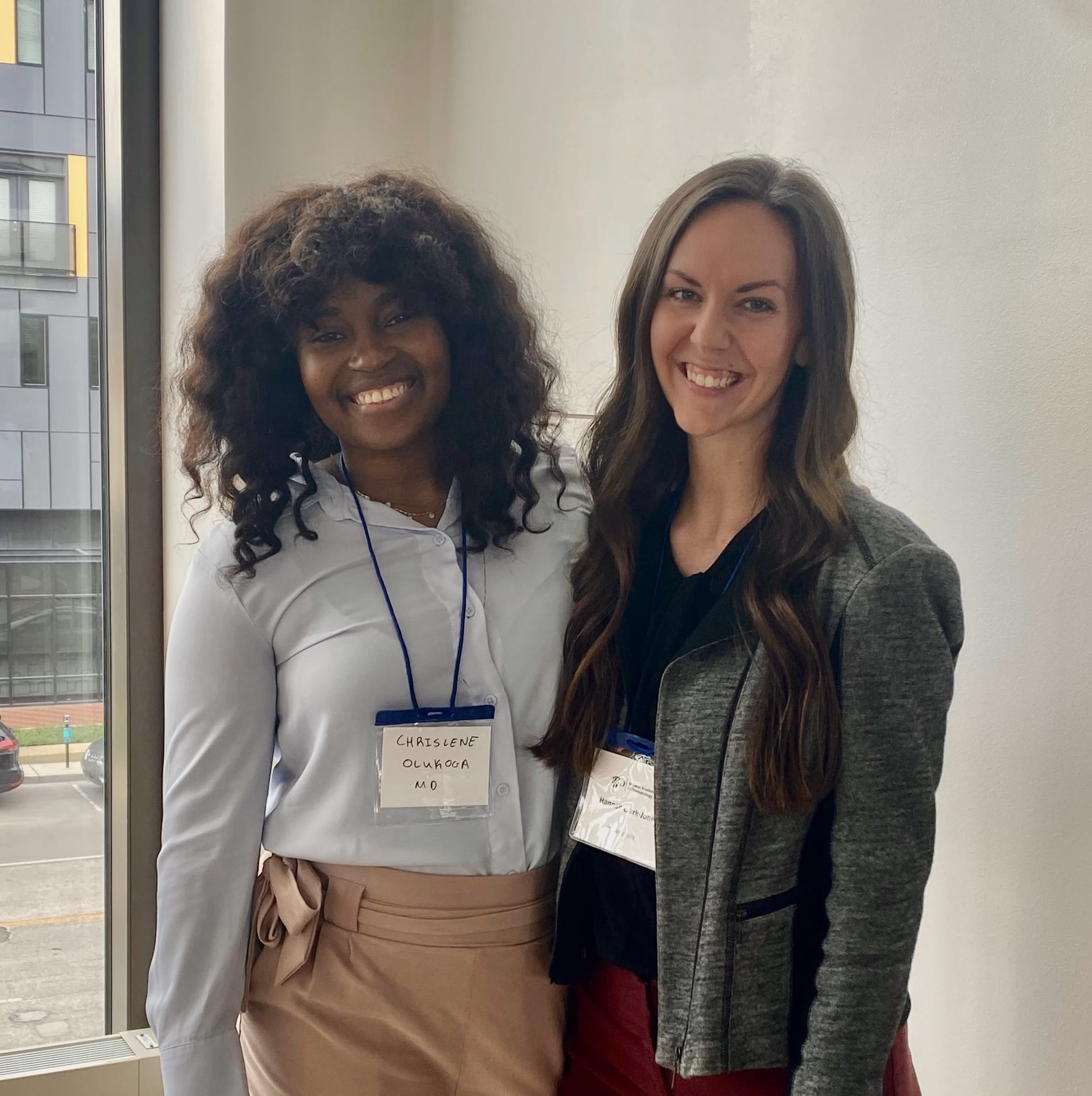 two residents attending a dermatology conference