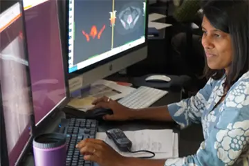 researcher looking at computer screens