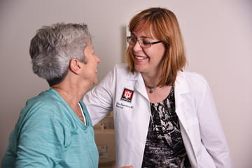 an Alzheimer's clinician meets with a patient