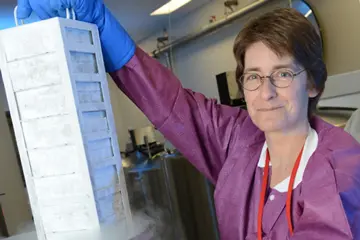 A researcher holds a case of biospecimens