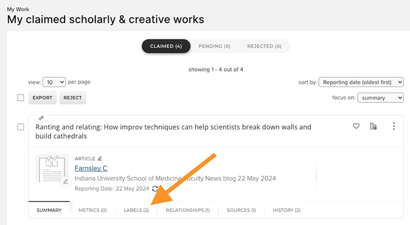 A screenshot of the Elements platform shows where to click on Labels in order to complete the task described.