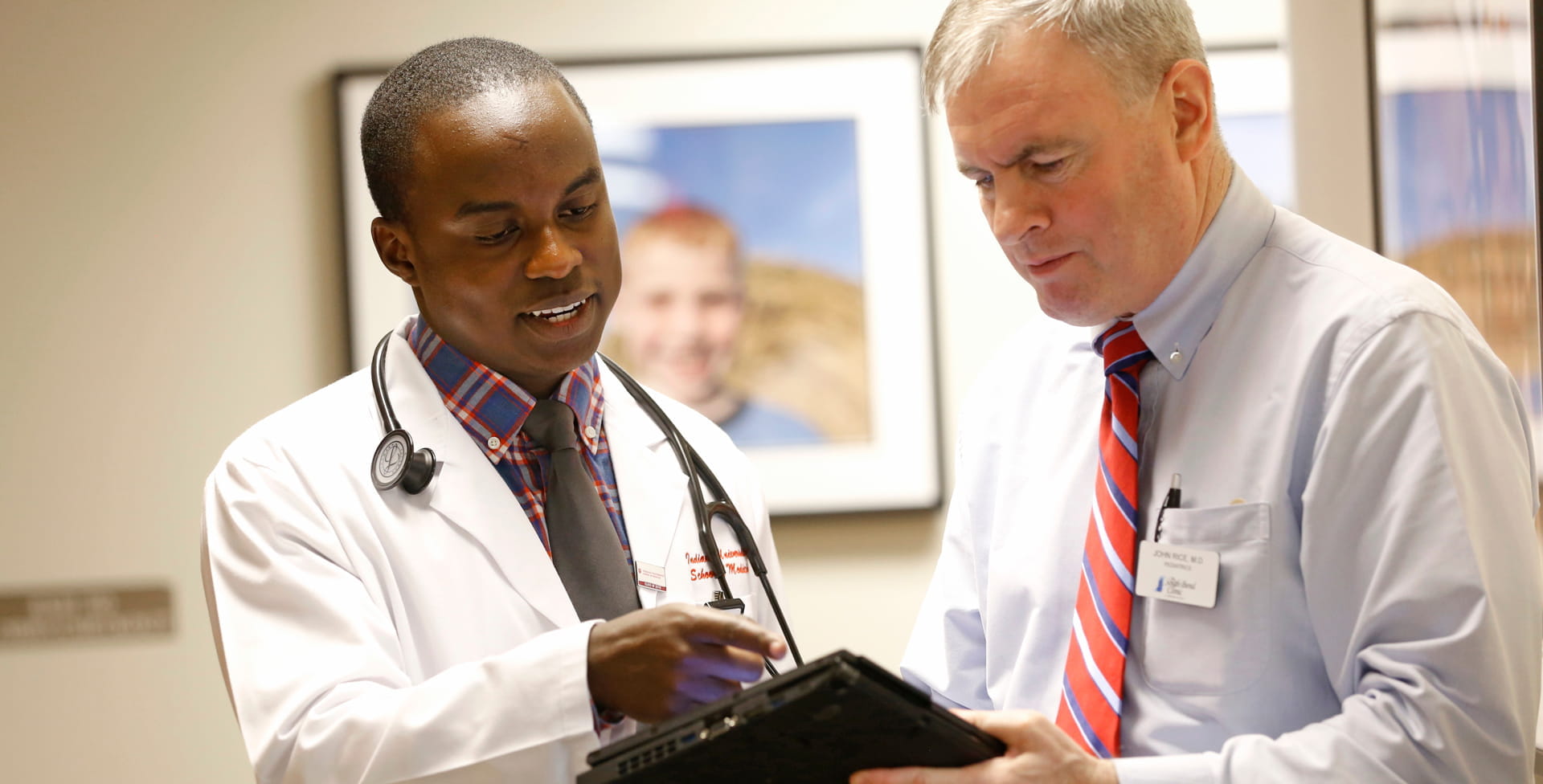 a student and a faculty member review a document together
