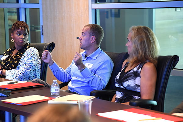 Faculty members have a discussion during a professional development workshop