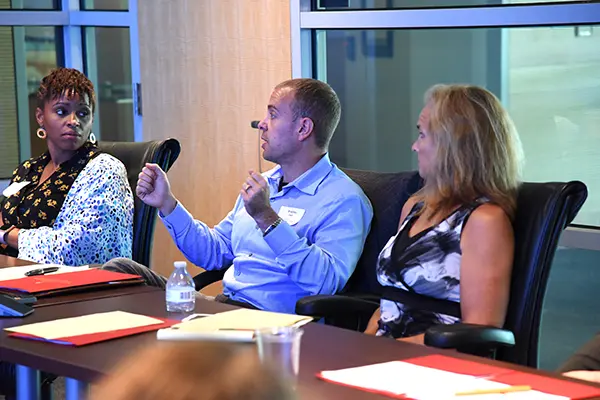 Faculty members have a discussion during a professional development workshop