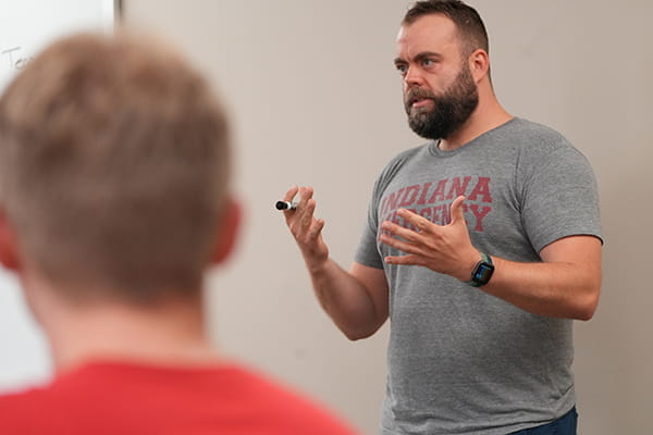 A teacher speaks during a lecture