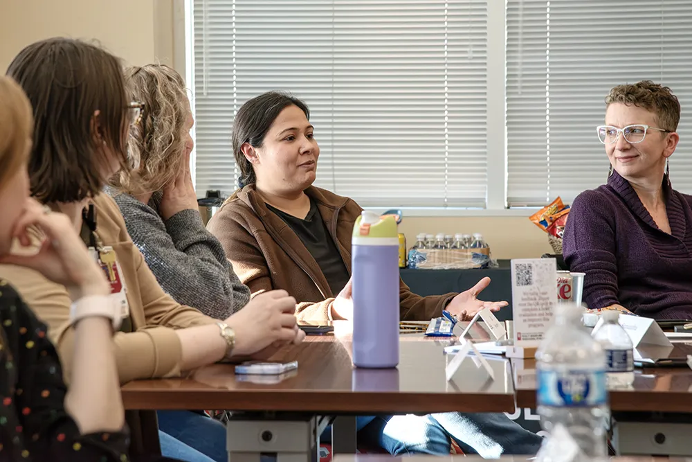 A group of faculty discuss an improvisational exercise during a Communicating Science session. 