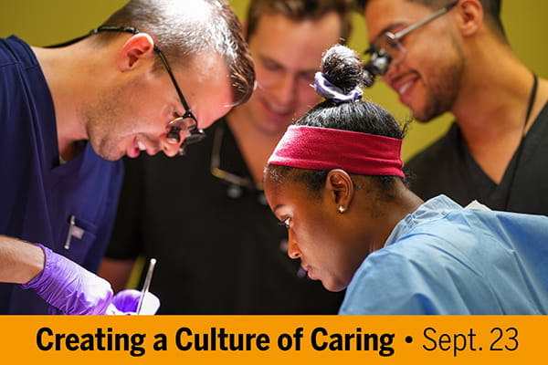 An instructor demonstrates an anatomy incision while three learners watch.