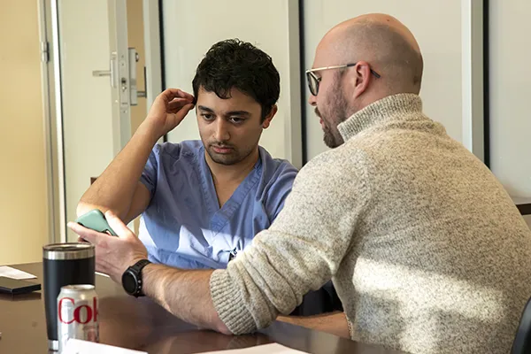 Two attendees participate in an improv exercise during Communicating Science.