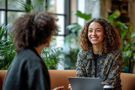 A mentor and mentee participate in a professional mentoring session.