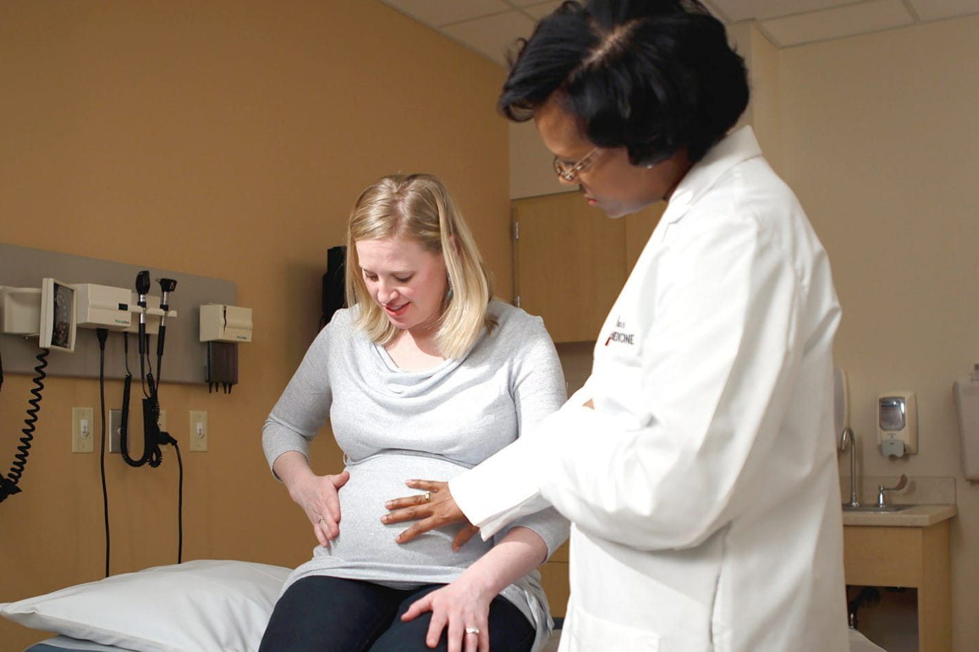 brownsyne tucker edmonds sees a pregnant patient in the clinic