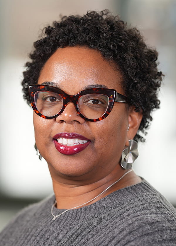 A headshot of Nyra Buckner