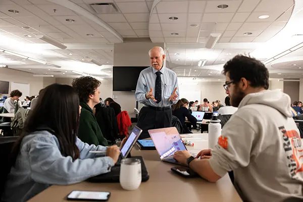 An educator answers learners' questions during an IU School of Medicine course.