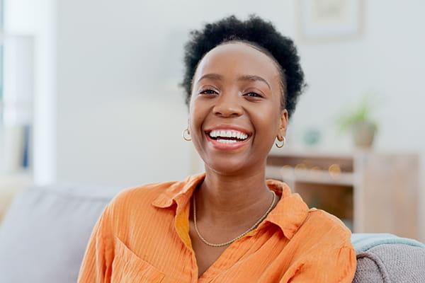 An adult woman is happy and well