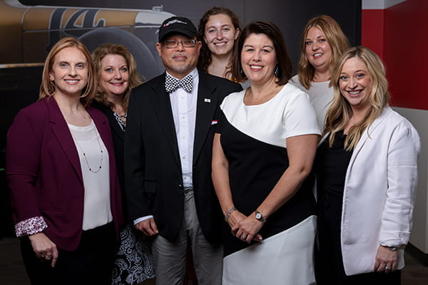 Staff of the IU School of Medicine Simon Cancer Center pose for a photo at the Indianapolis Motor Speedway.