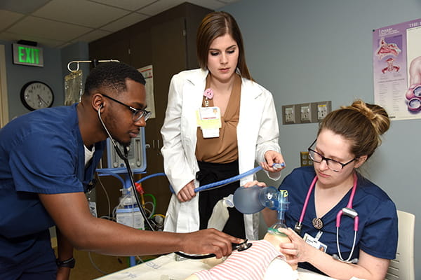 Students in the Health Professions Program practice respiratory therapy techniques