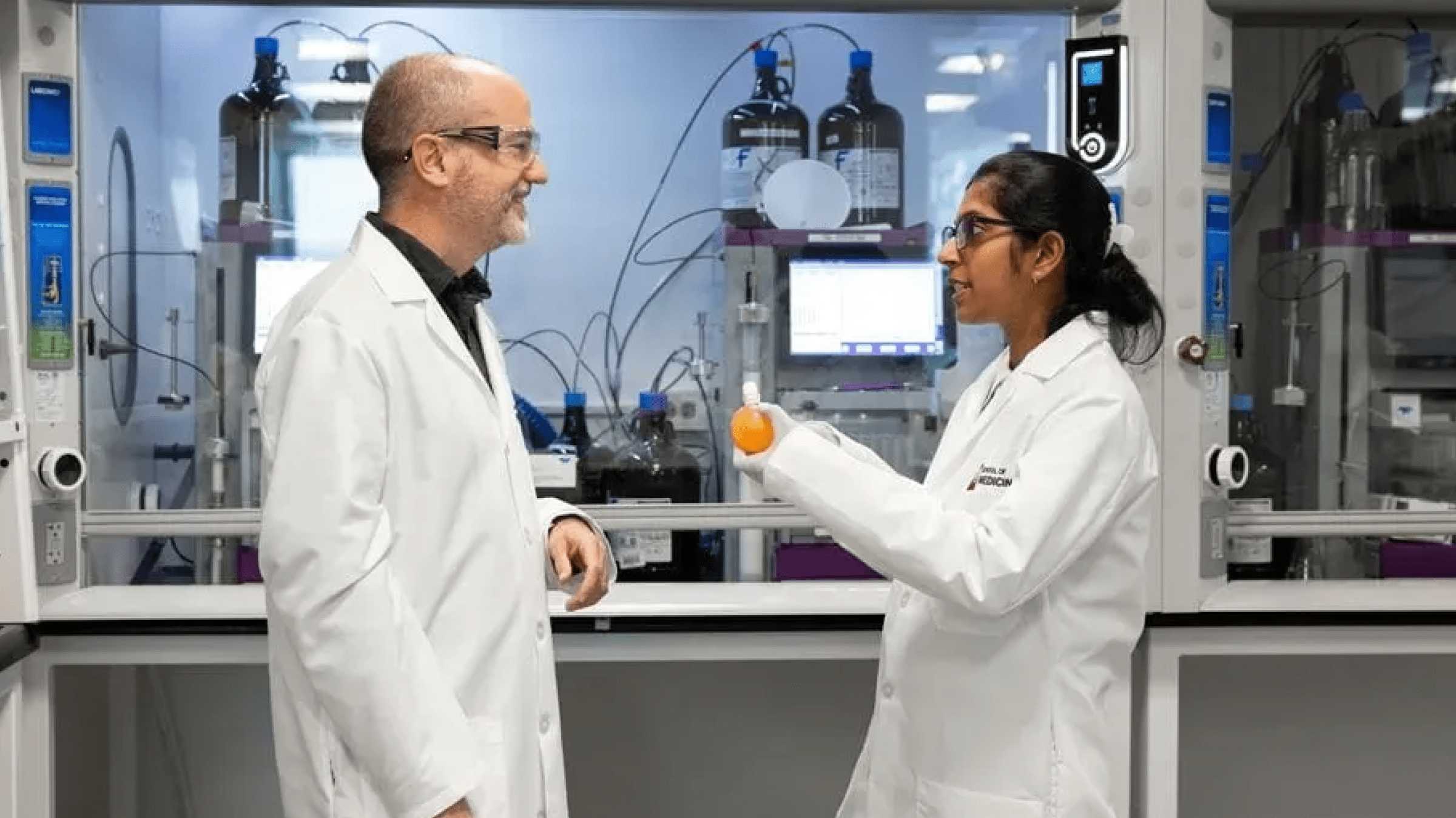 2 researchers talking