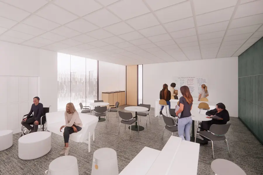 rendering of a common space shows multiple seating options and people working and talking together