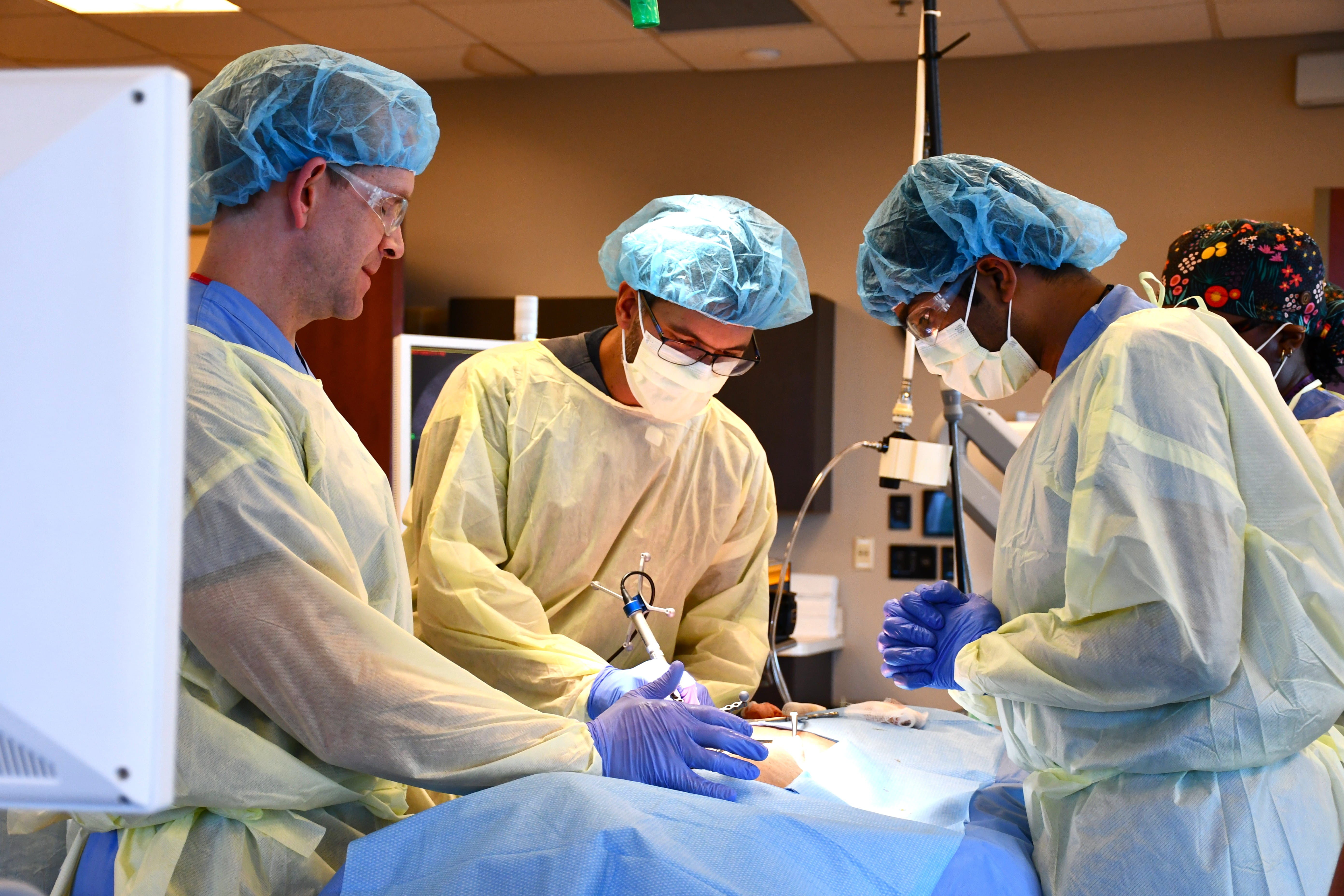 Residents training with a cadaver 