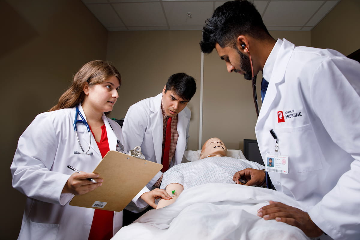 students in fort wayne work together to take a patient's physical and history
