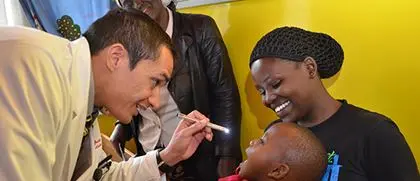 a doctor examines a young child's eyes
