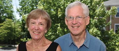 an older couple smiles for the camera
