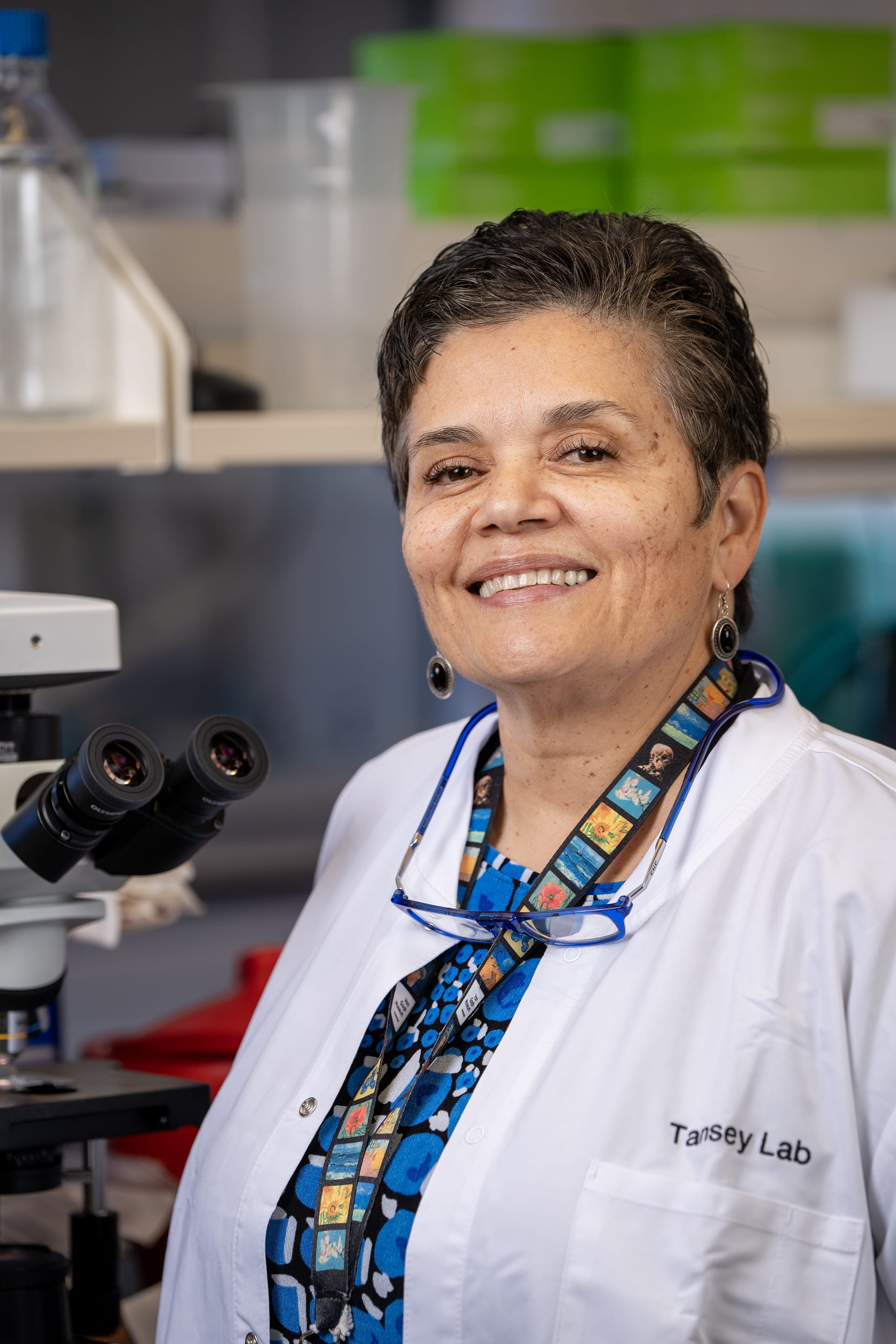malu tansey in a white coat in the lab