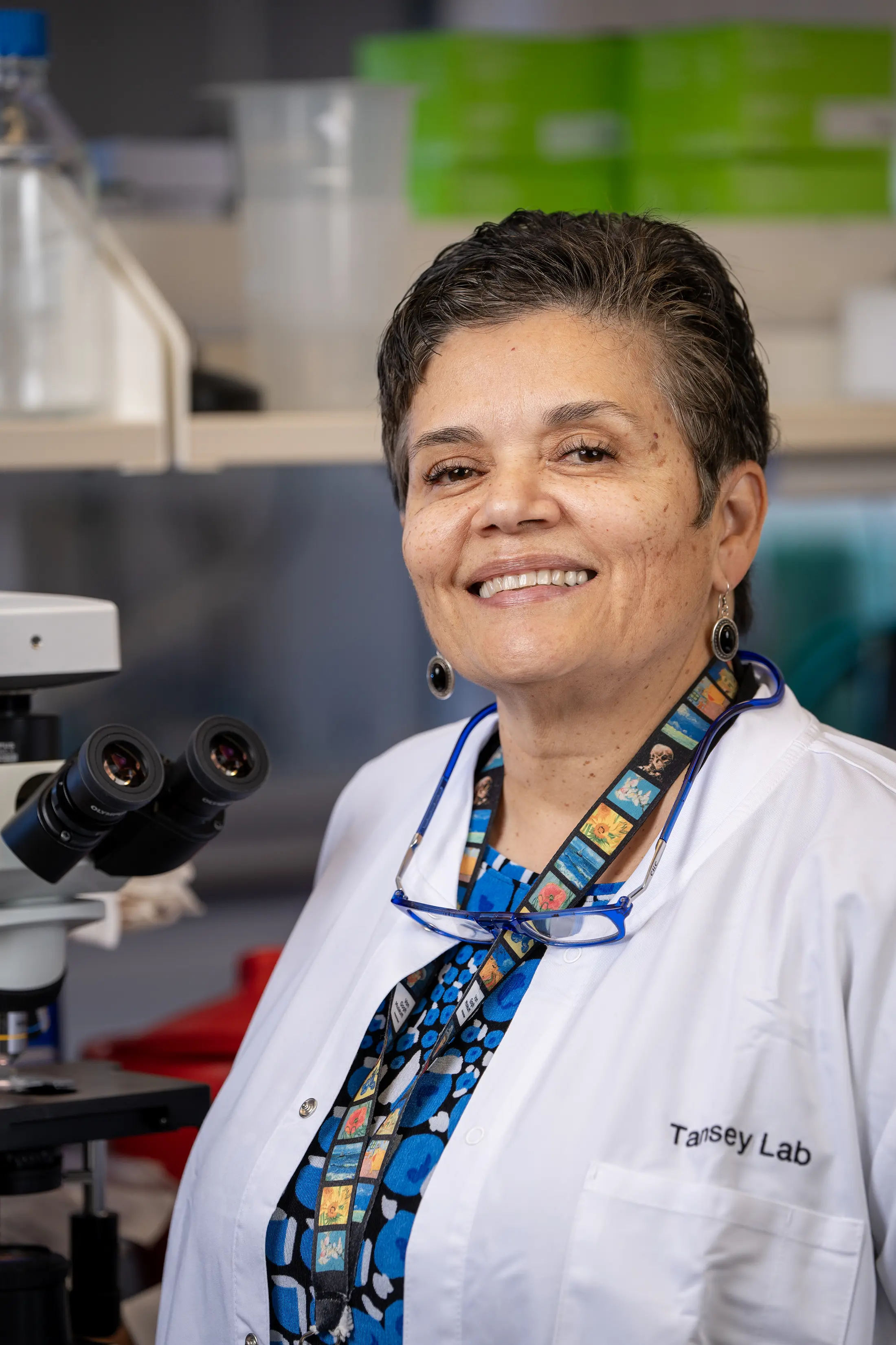 malu tansey in a white coat in the lab