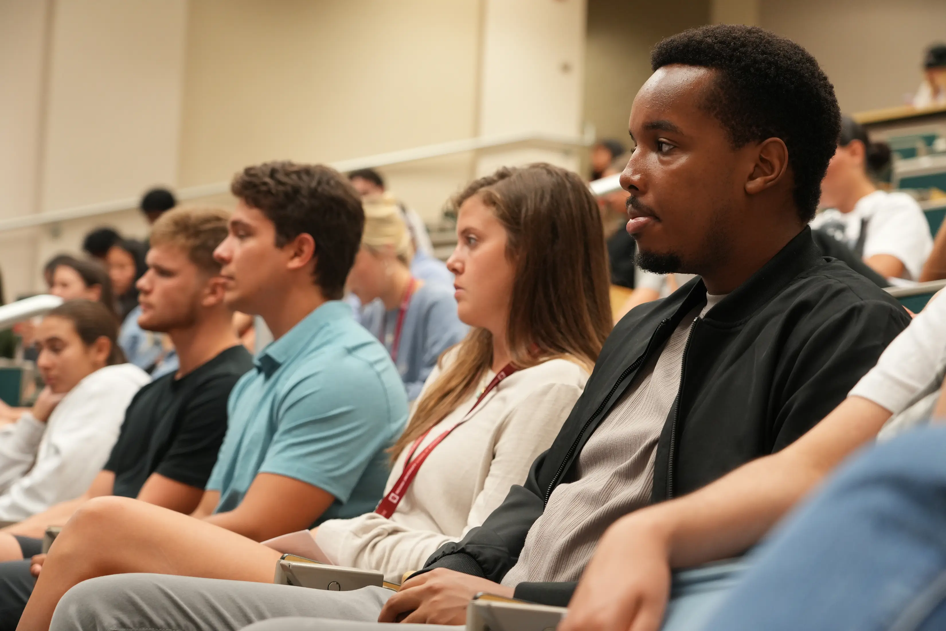 rows of medical students sit in a lecture hall at the muncie campus