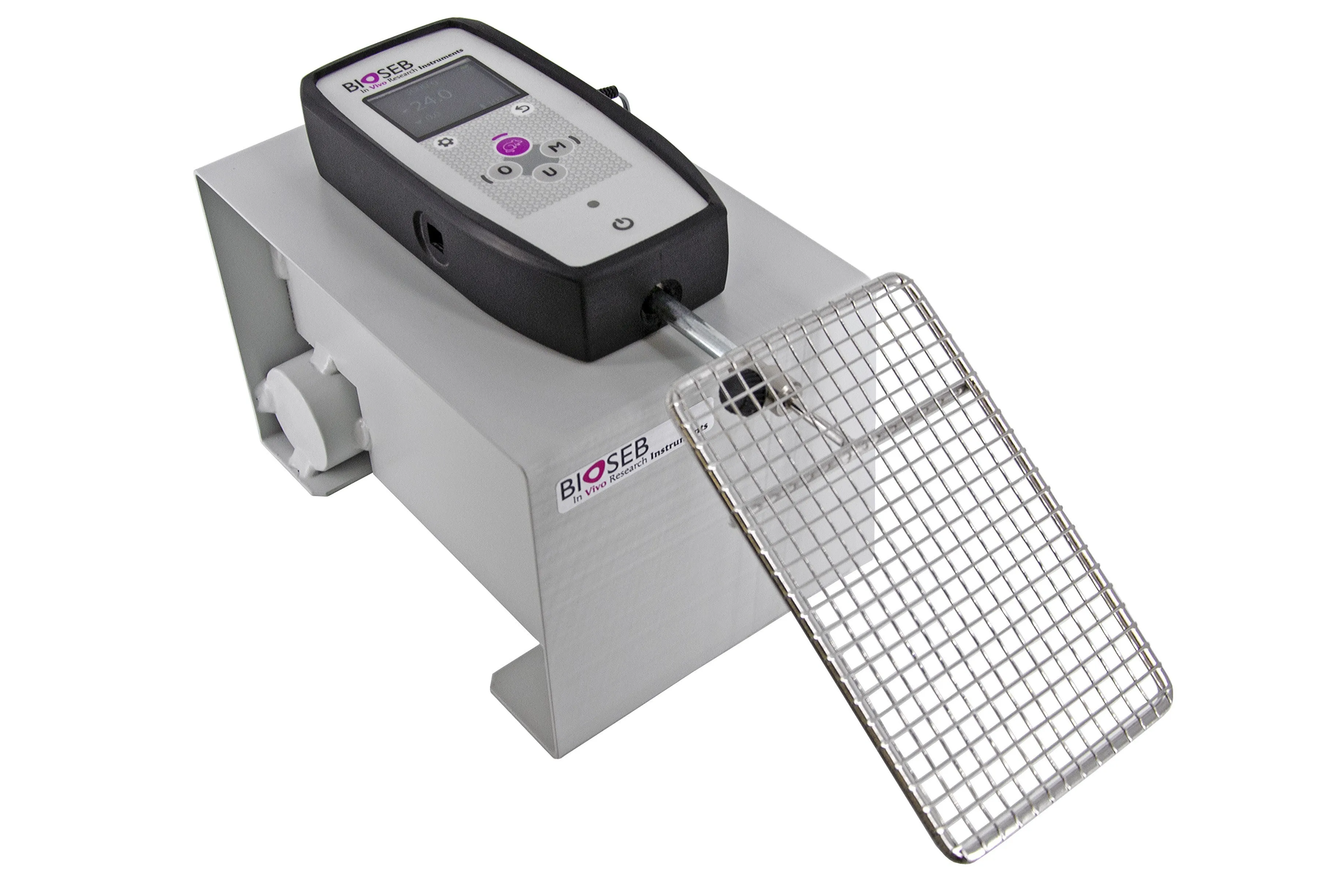 White rectangular box with measuring device on top and a metal grid hanging from it