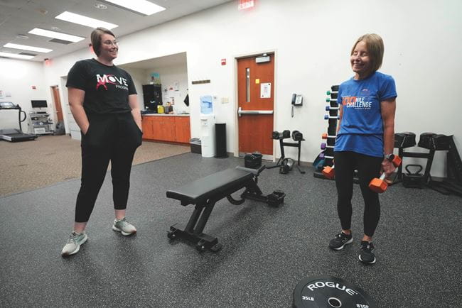 A person working out with a instructor