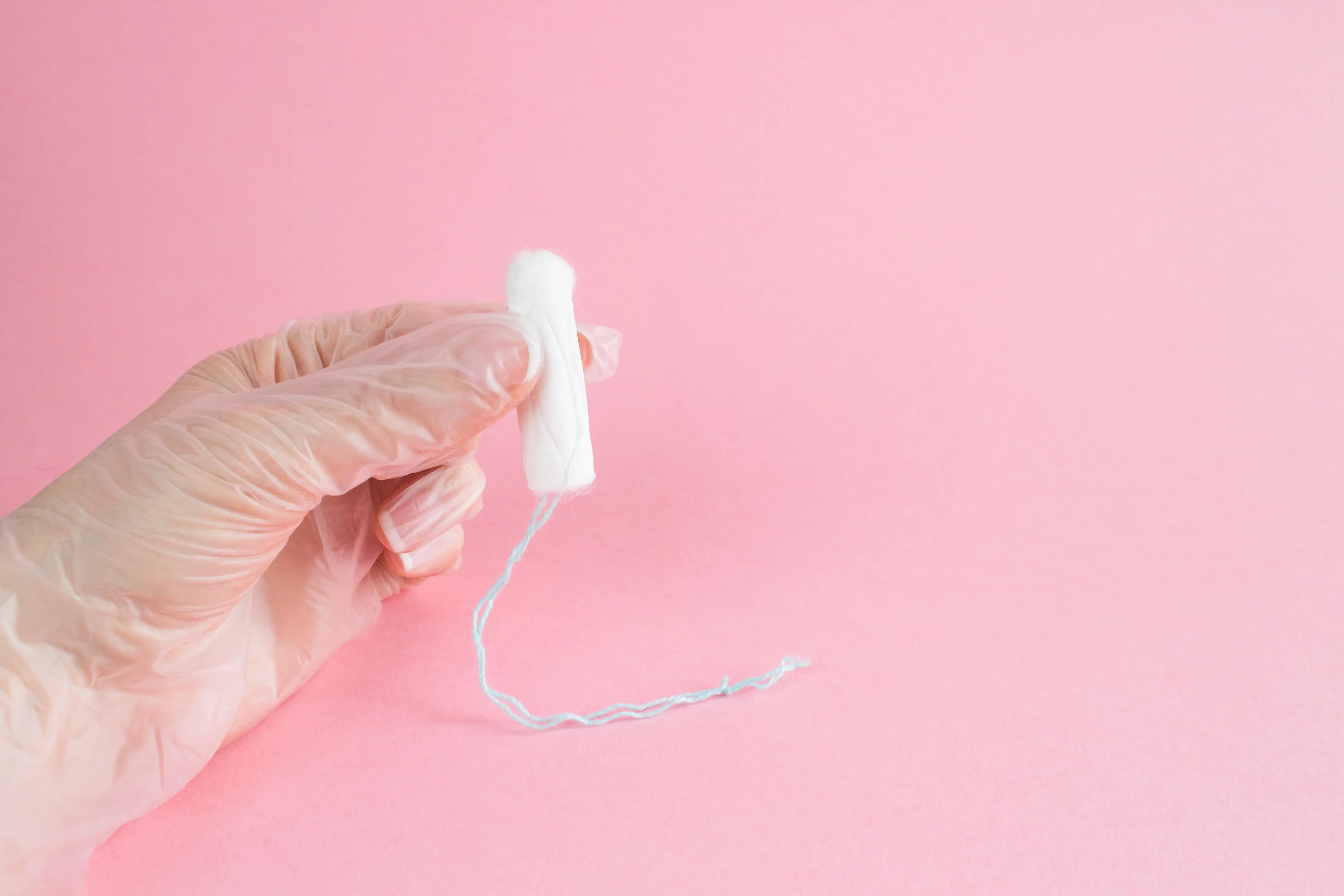 person holding a tampon