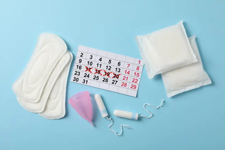 photo of pads, tampons and calendar