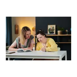 direct support professional helping a young woman with disability