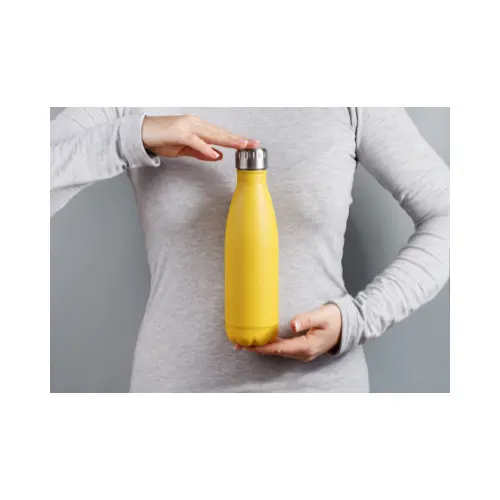 person holding a yellow water bottle