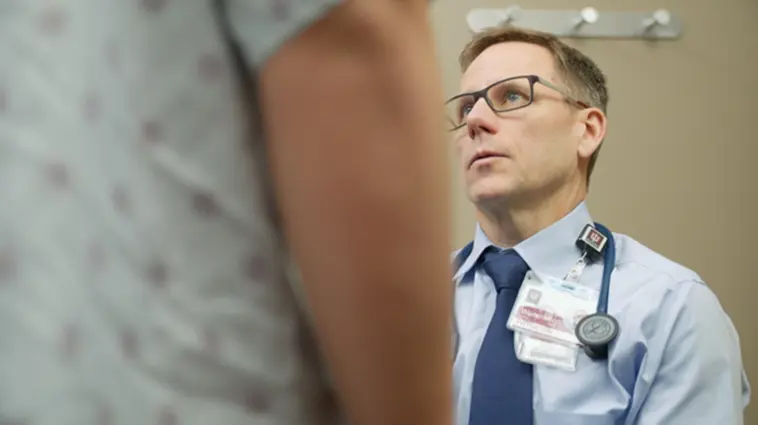 male doctor performing male exam