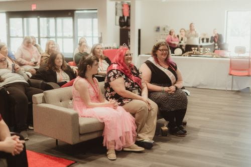 group photo of women with disabilities at a red carpet event