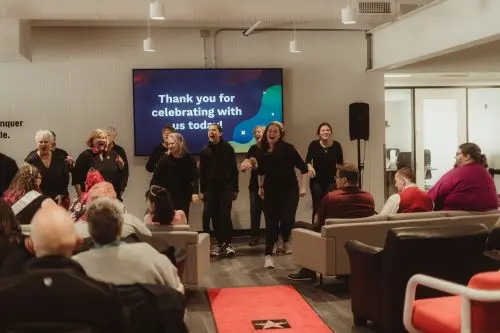 group of women singing for an audience 