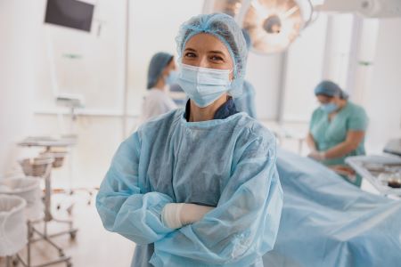 female doctor in blue scrubs in OR