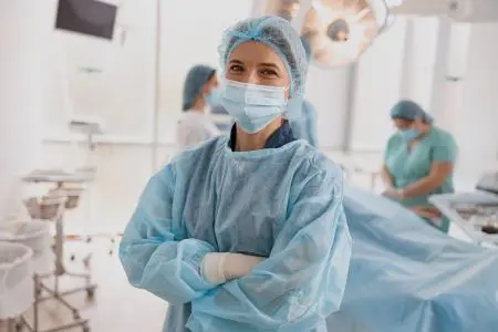 female doctor in blue scrubs in OR