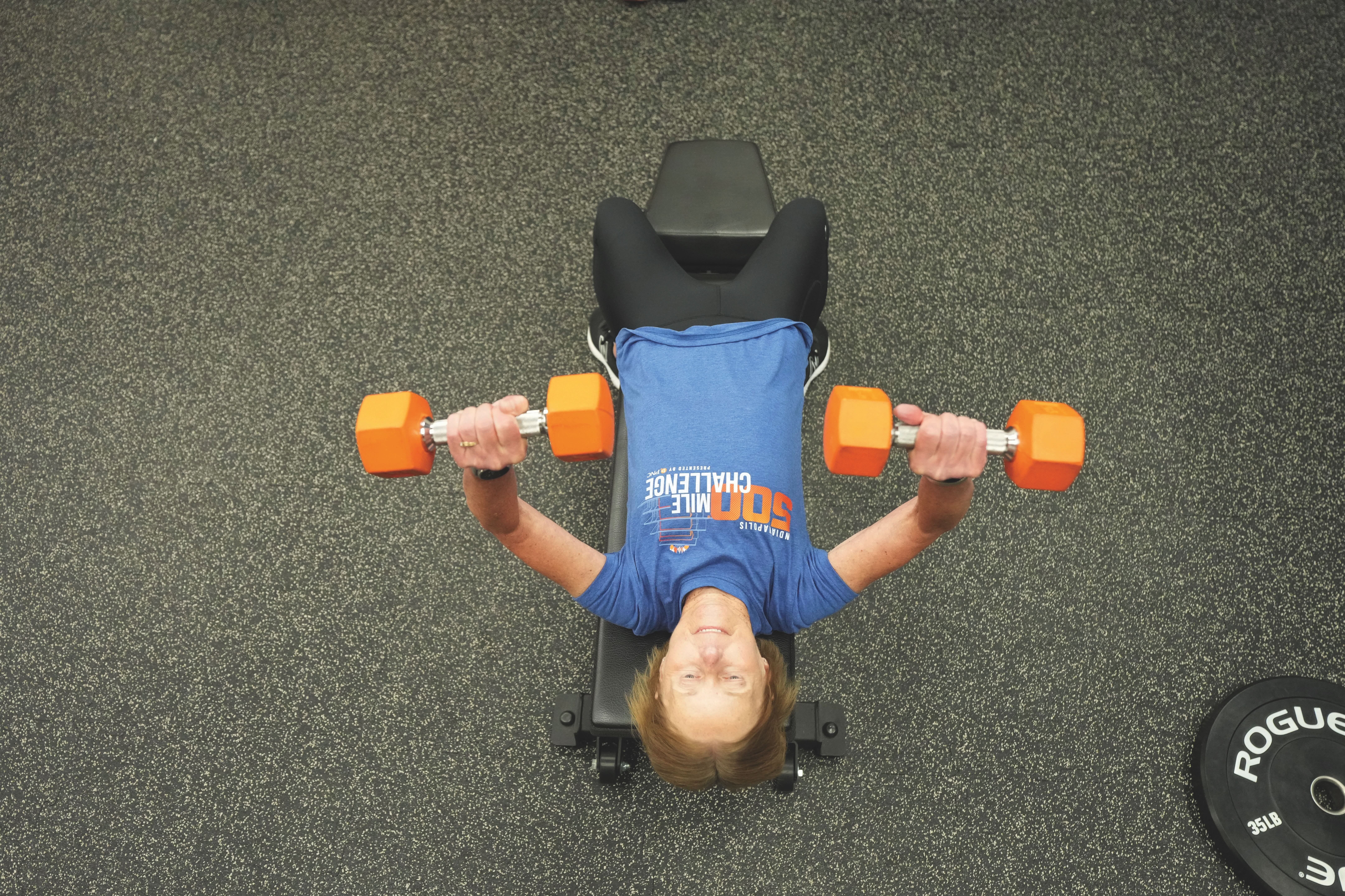 A girl doing bench press