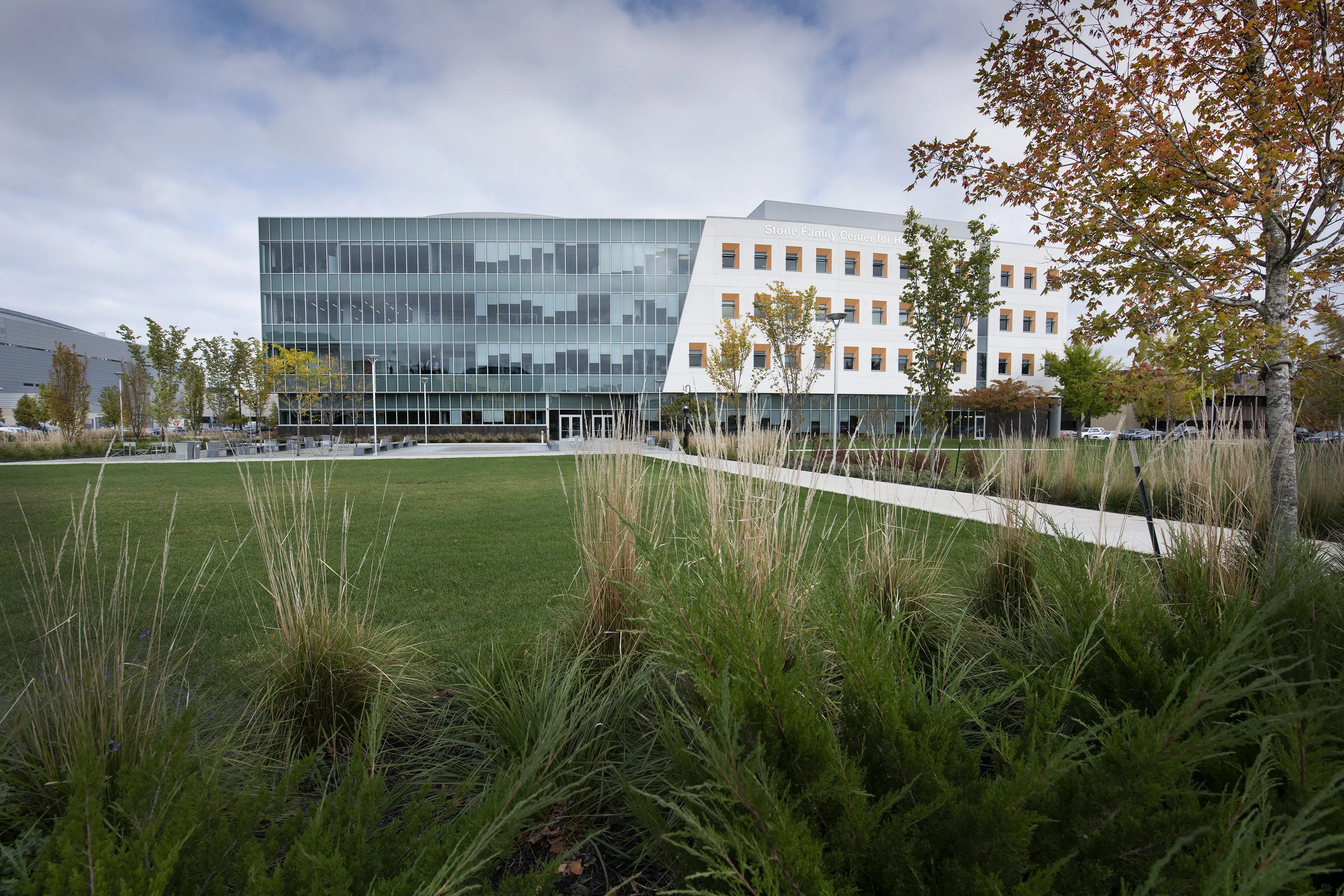 Green lawn and trees in front of an academic building in Evansville