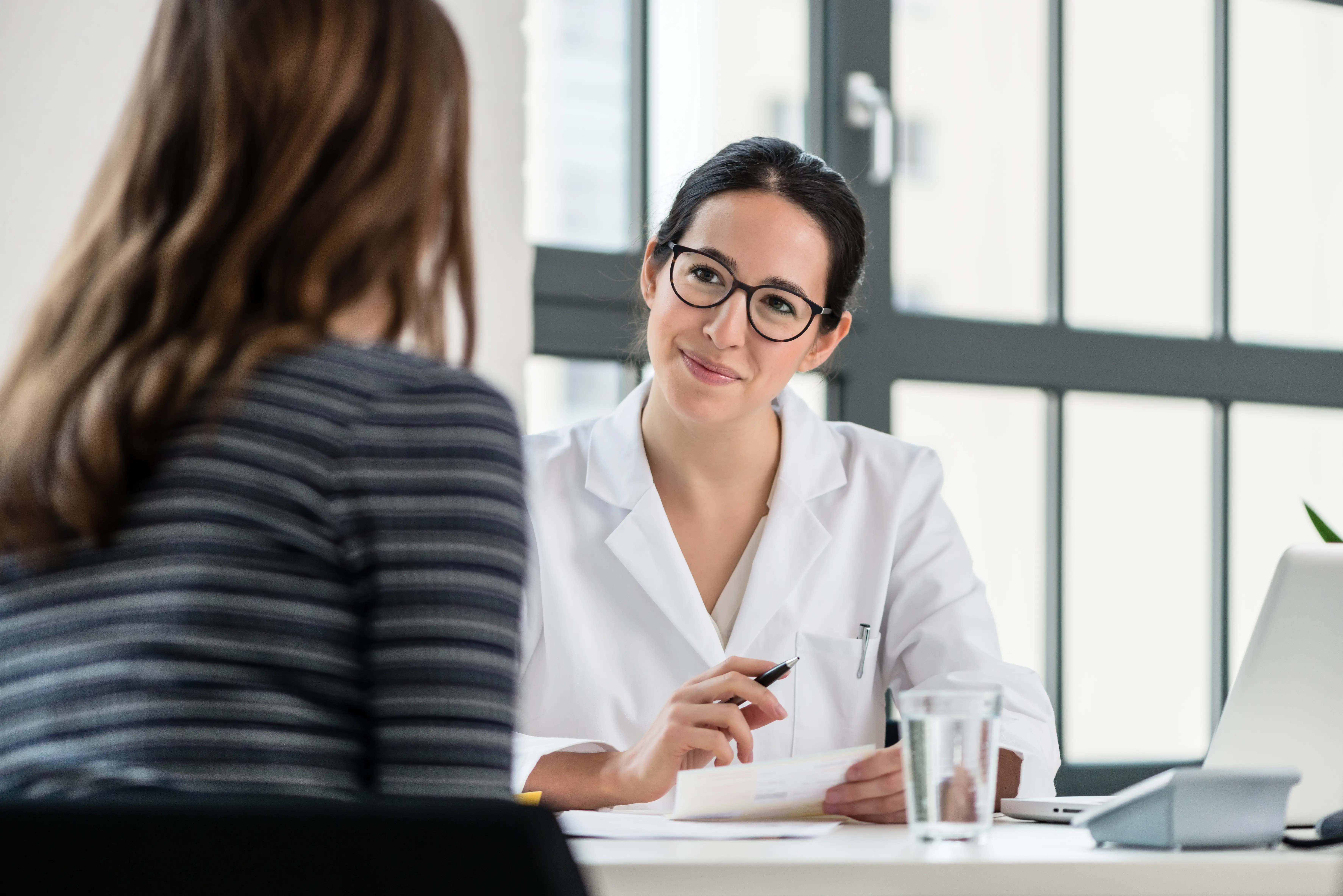 Physician meets with patient