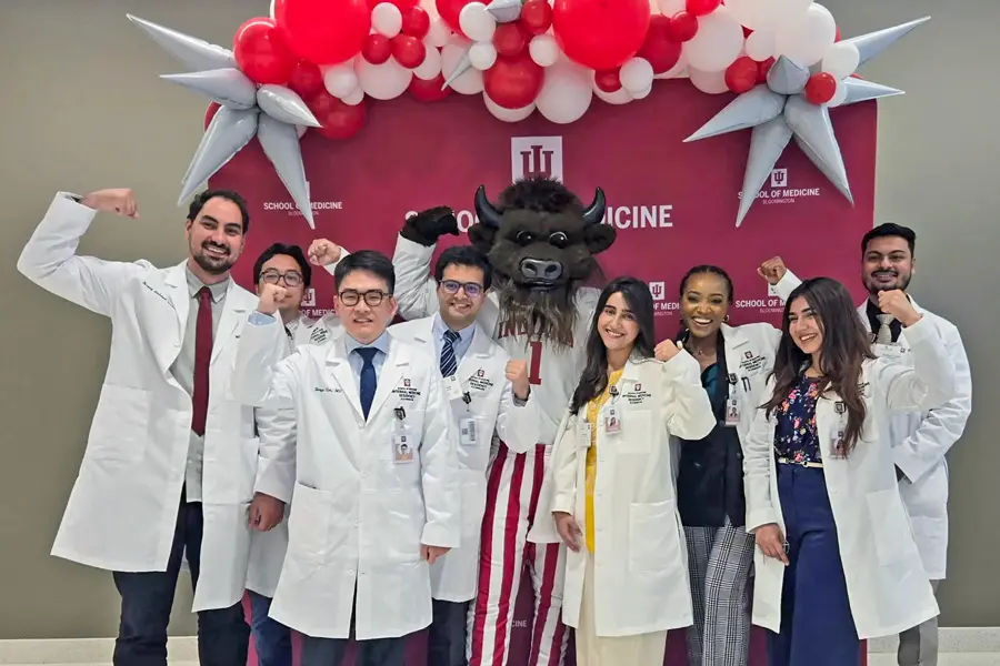 Hoosier the Bison is featured with the 8 Internal Medicine residents in front of an IU School of Medicine Banner.  Hoosier the Bison made a grand appearance during resident orientation week Lunch with Leaders and Ice Cream Social event. I