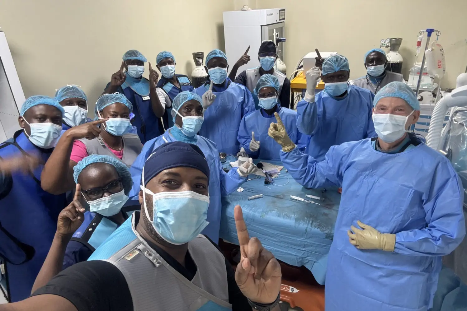 A group of IR radiologists pose for a group photo.