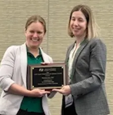Dr. Michelle Starr receiving award