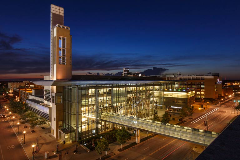 iu indianapolis student center building lit up at twilight