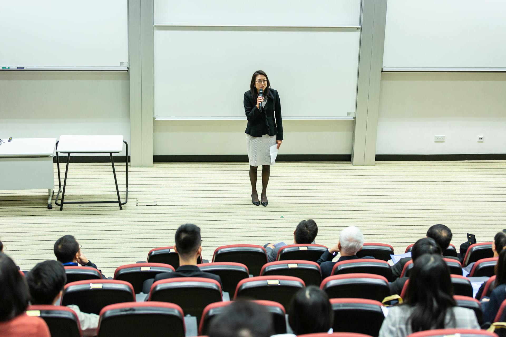 A woman presents a lecture.