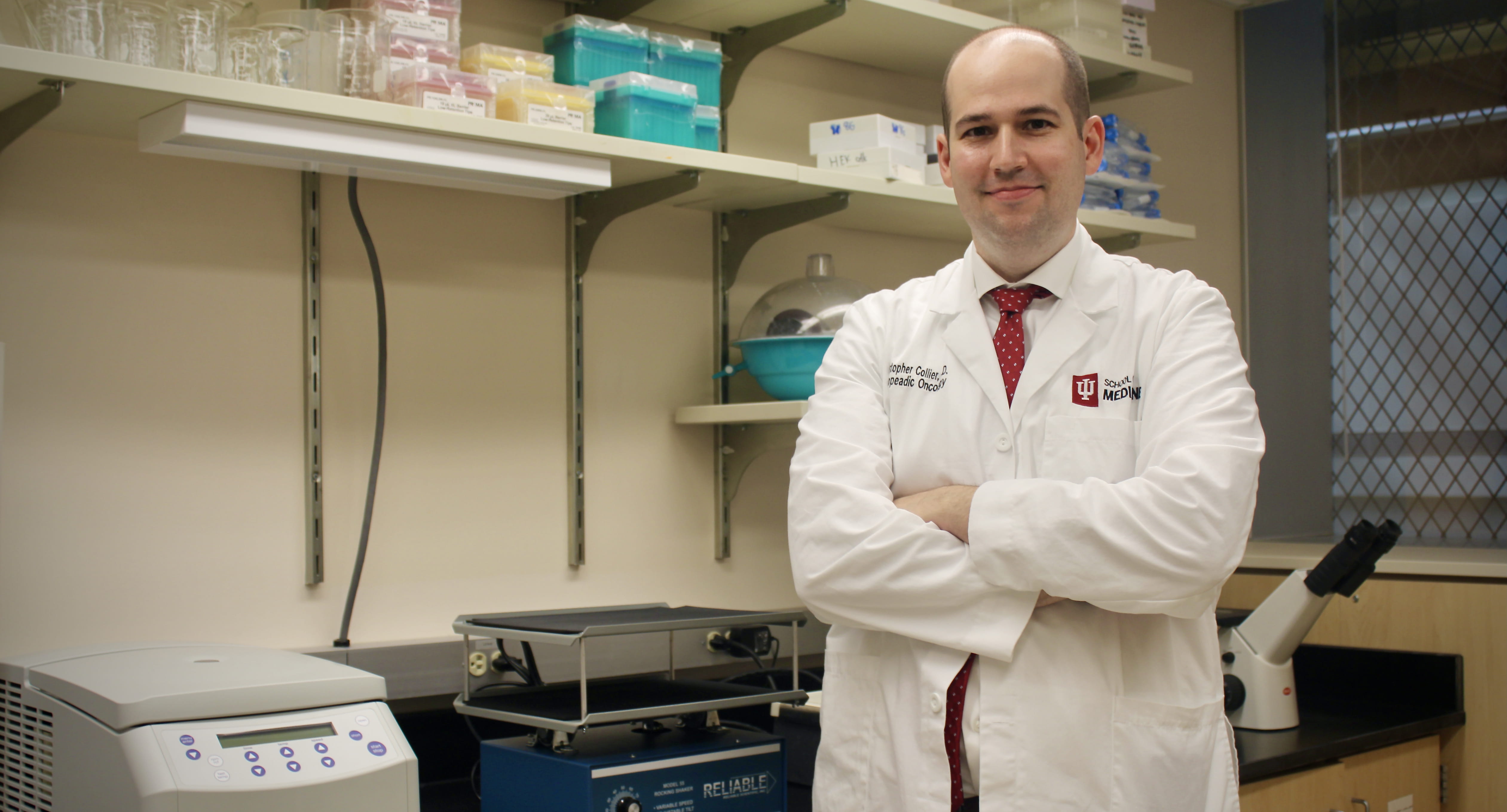 Christopher Collier, MD, stands in his lab