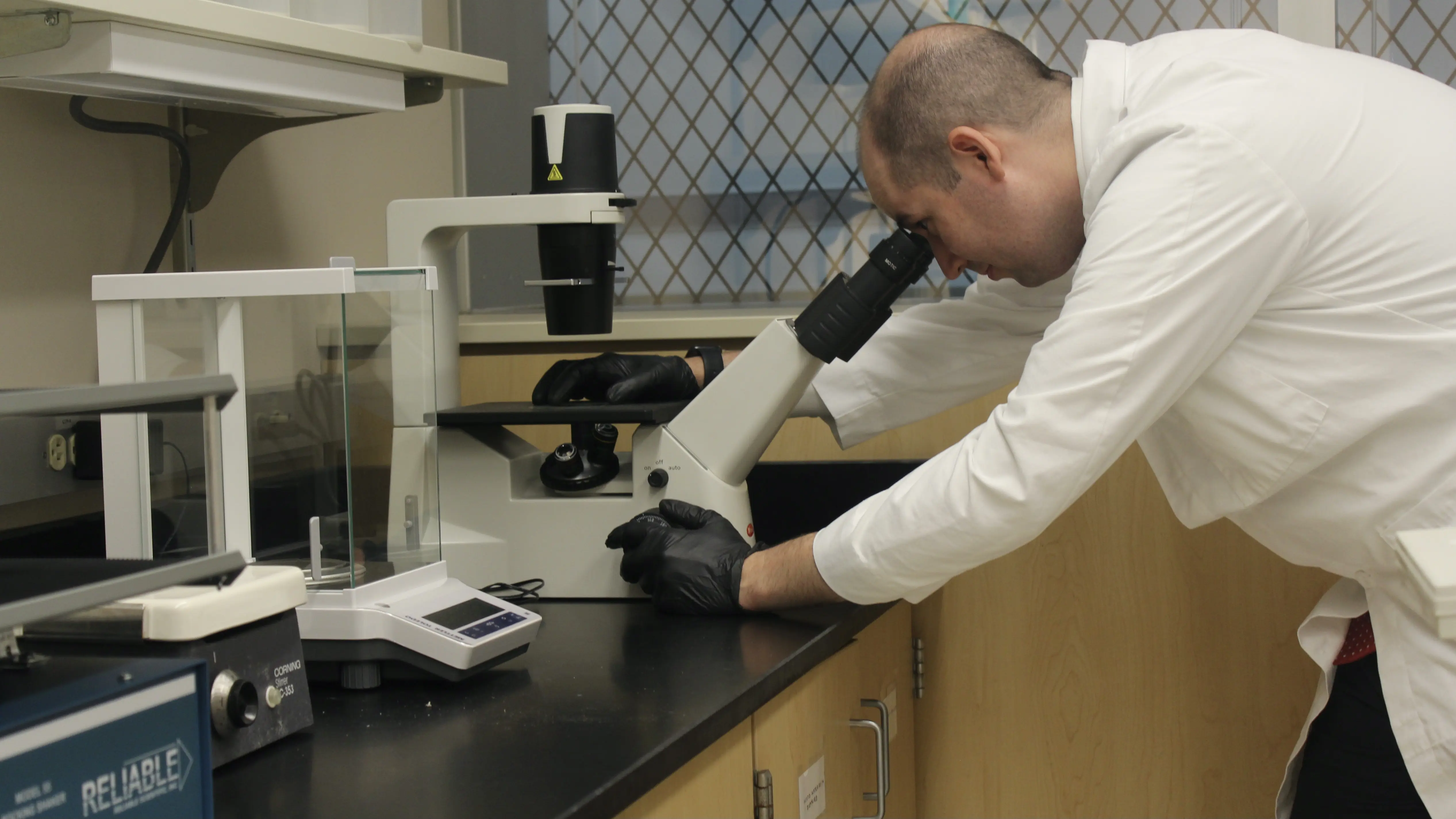 Christopher Collier, MD, works in his lab